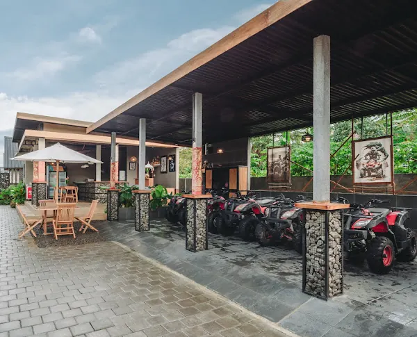 The villa's covered ATV garage beside an outdoor seating area