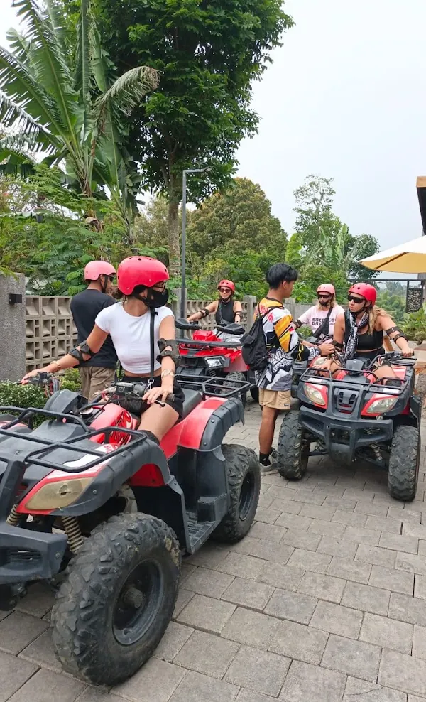 Guests in helmets getting ready on ATV quad bikes at the villa